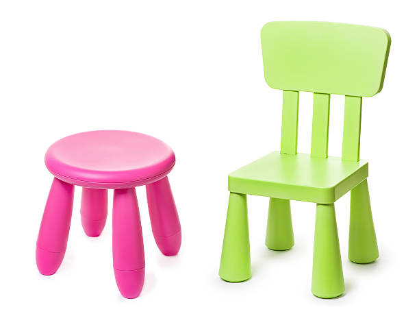 baby green plastic stools on a white background stock photo