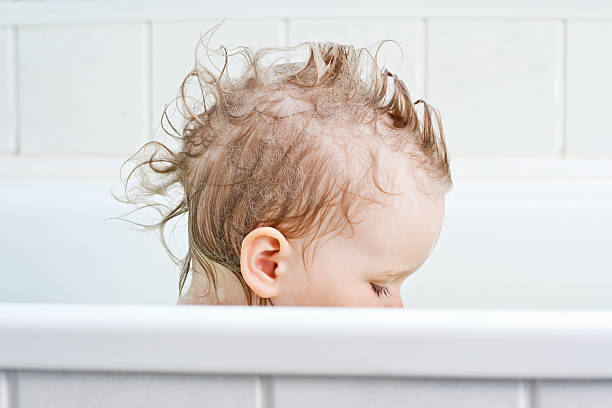 Baby in bath  baby bath stock pictures, royalty-free photos & images