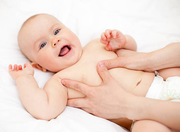 Baby massage stock photo