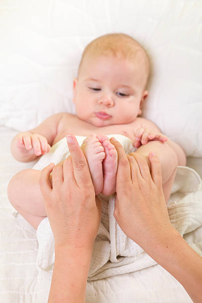 Baby Massage Series XXXL Baby Massage Series tickling beautiful women pictures stock pictures, royalty-free photos & images