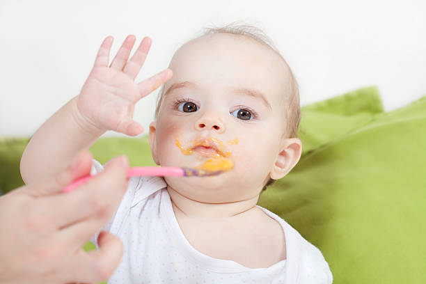 Baby meal time stock photo