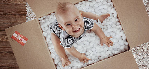 Baby. Newborn in the post parcel. Top view stock photo