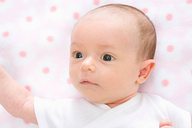 Baby on pink stock photo