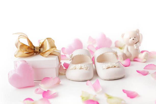 baby shoes and gift stock photo