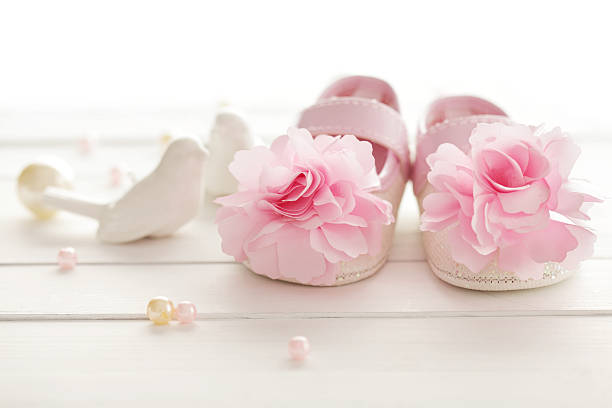 baby shoes baby shower decoration - it is a girl it's a girl stock pictures, royalty-free photos & images