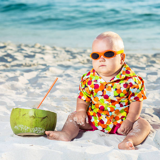 Baby with coconut stock photo