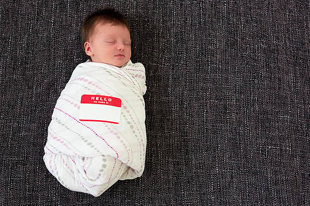 Baby with name tag stock photo