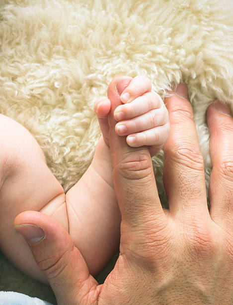 Baby's hand stock photo