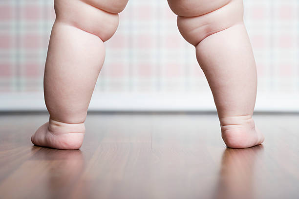 Babys legs  overweight baby stock pictures, royalty-free photos & images