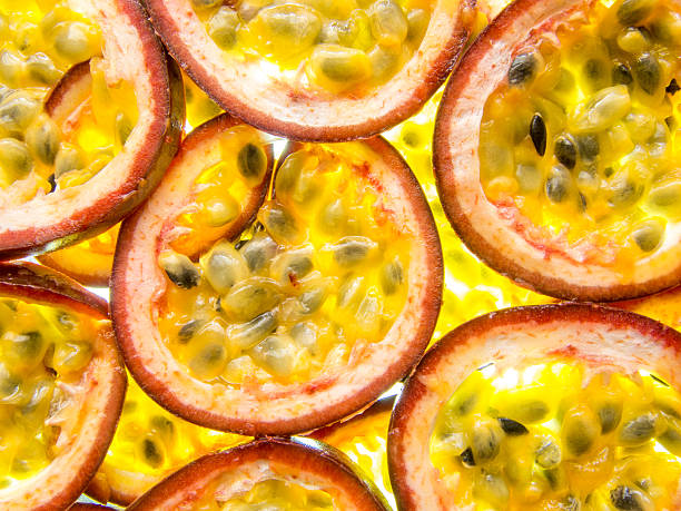 back lit slices of ripe maracuja passion fruit - granadilla imagens e fotografias de stock