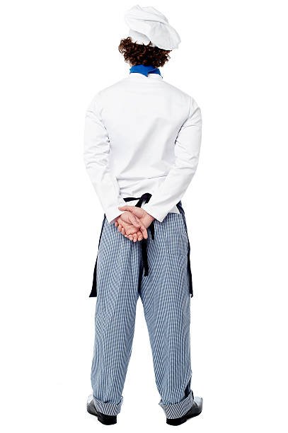 Back pose of a male chef in uniform stock photo