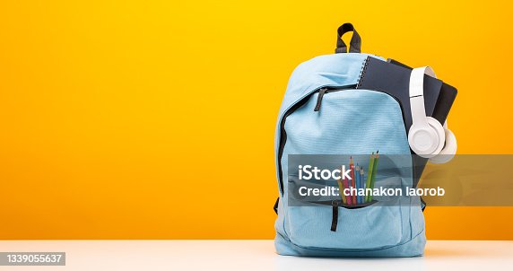 istock Back to school background. Stationery Supplies in the school bag. Banner design education On Yellow background. 1339055637