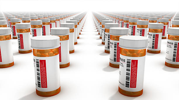 Back view of Pill Bottles Endless Pill Bottles xanax pills stock pictures, royalty-free photos & images
