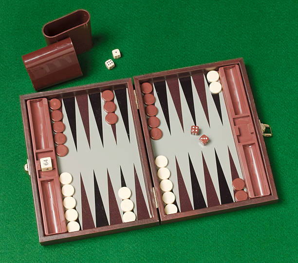 backgammon game on green background stock photo