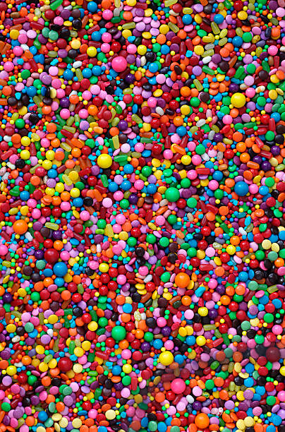 Background filled with assorted colorful candy A colourful background of assorted candy. pick and mix stock pictures, royalty-free photos & images