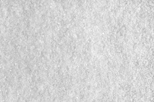 Background from white sea salt. Coarse rock salt texture. stock photo