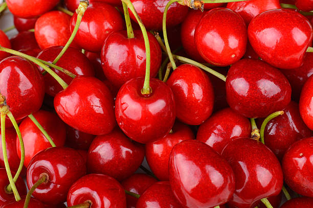 Background made from heap of many fresh red cherries stock photo
