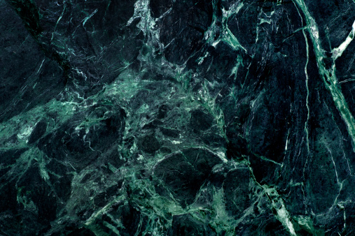 This is an overhead photo of a green marble background.
