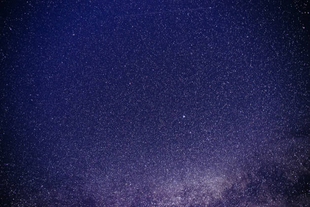 Background of starry purple night sky with the Milky Way stock photo