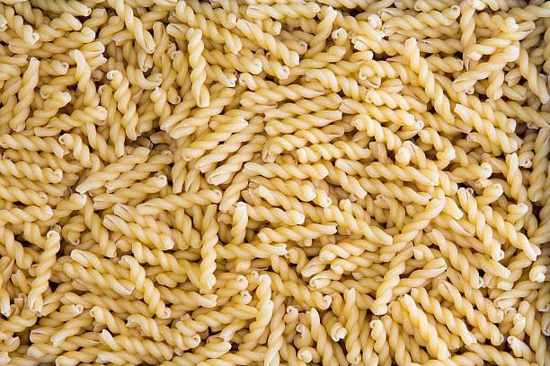 Background texture of dried gemelli pasta stock photo