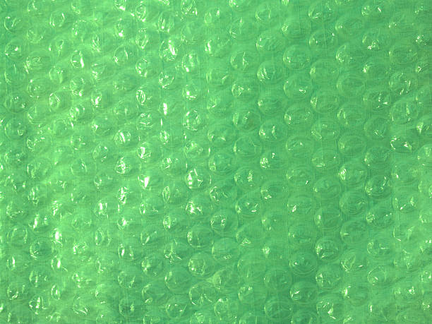 "Backgrounds: Textural": Bubble Wrap in Lime Green stock photo