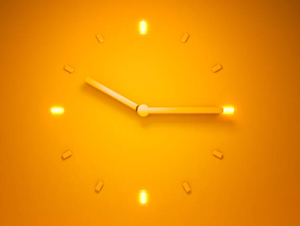 Backlit Orange clock time stock photo