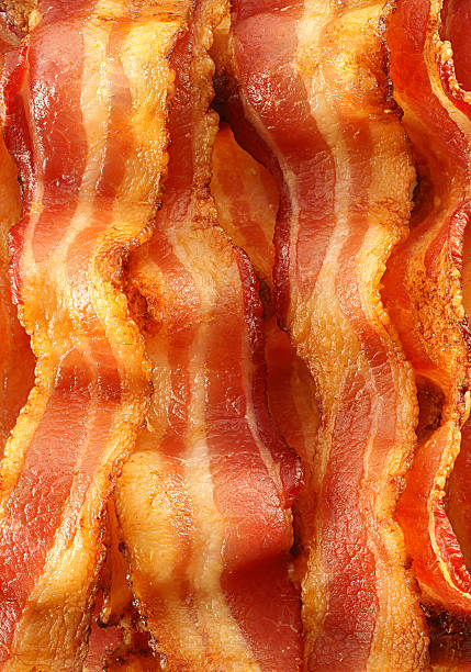 Bacon Background "Full frame background of crispy, smokey, delicious bacon.More delicious bacon goodness:" bacon stock pictures, royalty-free photos & images