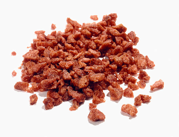 bacon bits cut out on white  bacon stock pictures, royalty-free photos & images