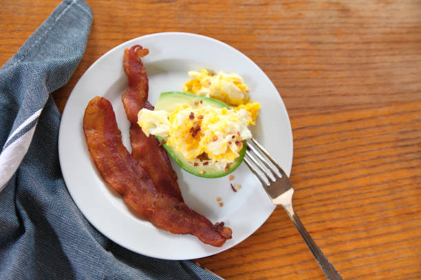 Bacon, eggs and avocado breakfast stock photo
