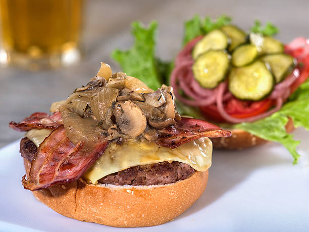 Bacon, mushroom and Swiss cheese burger stock photo