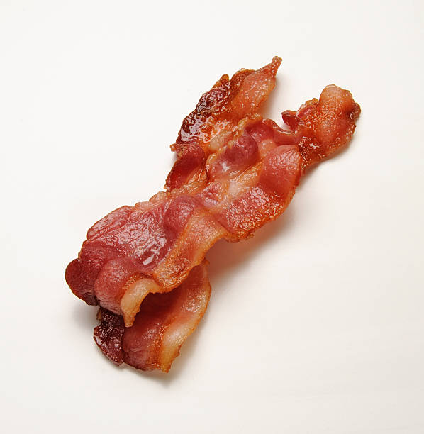 Bacon Two strips of hot bacon crunchy stock pictures, royalty-free photos & images