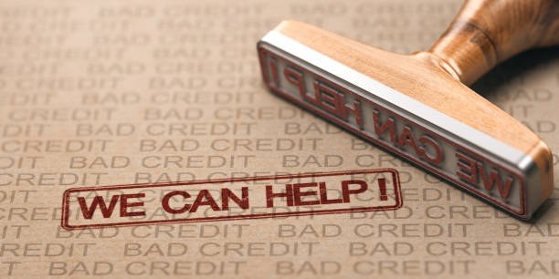 Bad Credit Fix. Debt Solutions Concept. Close up of a rubber stamp with the text we can help over brown paper bad credits watermarks. Concept of debts solutions. foreclosure stock pictures, royalty-free photos & images