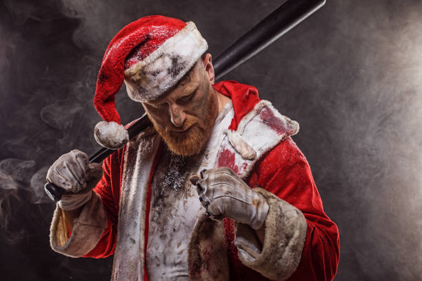 Bad Santa Claus with gun Portrait of weapon wielding tattooed bad ass Santa Claus nra stock pictures, royalty-free photos & images