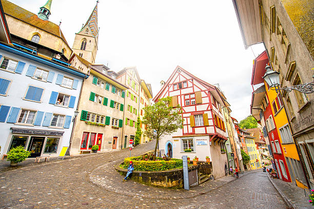 Baden old town in Switzerland Baden, Switzerland - June 30, 2016: Street view in the center of the old town with Half-timbered house and church tower in Baden, Switzerland aargau canton stock pictures, royalty-free photos & images