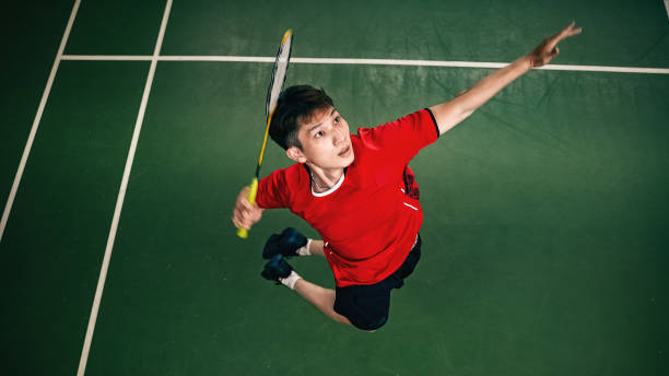 《Badminton Spirit》Jump smash during the match/Top view stock photo