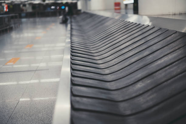 Baggage conveyor belt in an airport stock photo