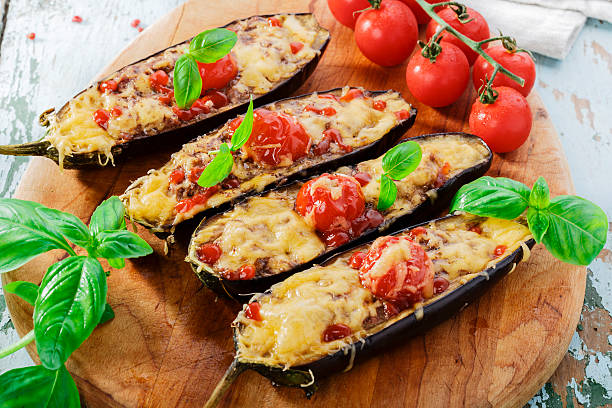 baked eggplant with cheese meat and tomatoes stock photo
