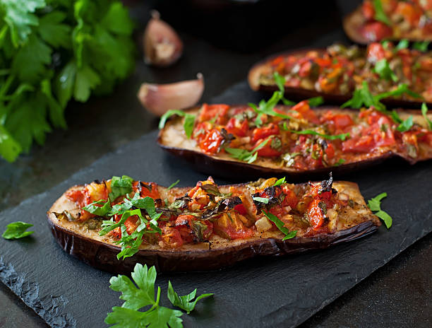 Baked eggplant with tomatoes, garlic and paprika Baked eggplant with tomatoes, garlic and paprika eggplant stock pictures, royalty-free photos & images