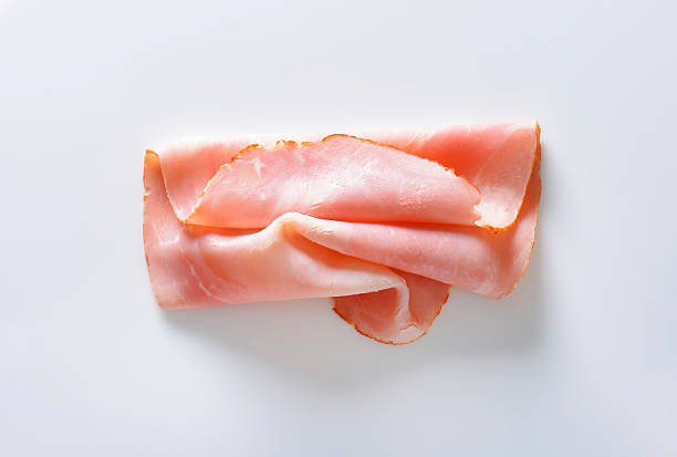 Baked ham slice Thin slice of baked ham ham stock pictures, royalty-free photos & images