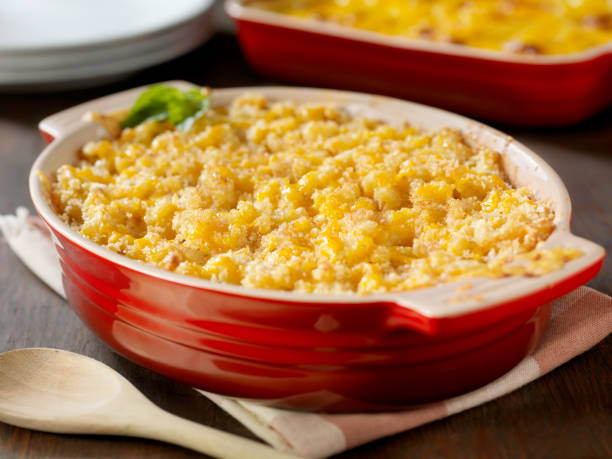 Baked Macaroni and Cheese Baked Macaroni and Cheese with Bread Crumbs and Fresh Basil -Photographed on Hasselblad H3D-39mb Camera casserole dish stock pictures, royalty-free photos & images
