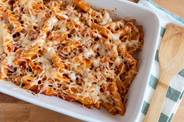 Baked Macaroni with Chorizo and Emmental Cheese stock photo