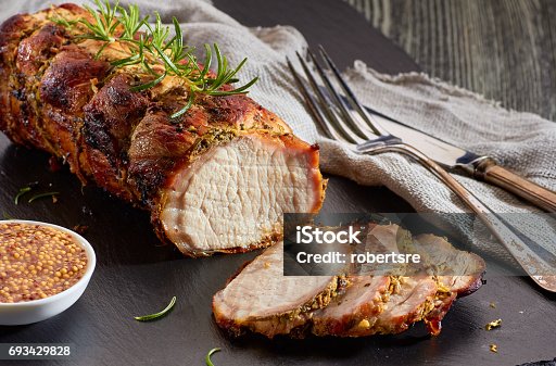 istock Baked pork loin with whole grain mustard 693429828