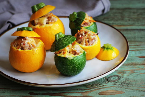 Baked round zucchini stuffed with minced meat, vegetables, and cheese stock photo