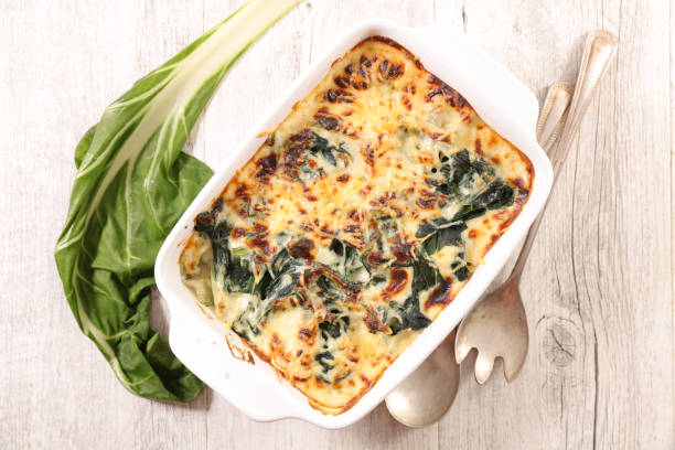 baked vegetable chard gratin- top view baked vegetable chard gratin- top view gratin stock pictures, royalty-free photos & images