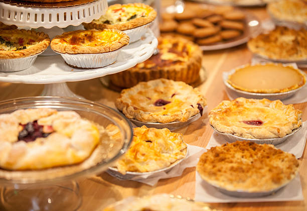 Bakery Counter Full of Assorted Pastries and Pies stock photo