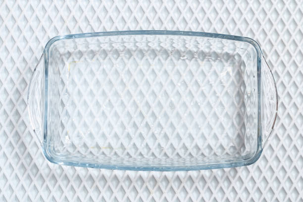 A baking dish cleaned from thick layer of carbon. Glassware for baking after washing with a steam cleaner. stock photo