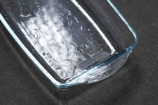 A baking dish cleaned from thick layer of carbon. Glassware for baking after washing with a steam cleaner. stock photo
