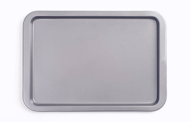 Baking Sheet Bird's eye view shot of a kitchen baking sheet on a white background. baking sheet stock pictures, royalty-free photos & images