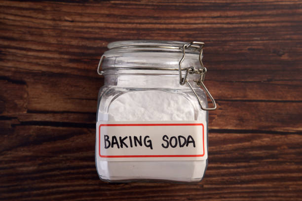 baking soda directly above of baking soda on the wooden background baking soda stock pictures, royalty-free photos & images