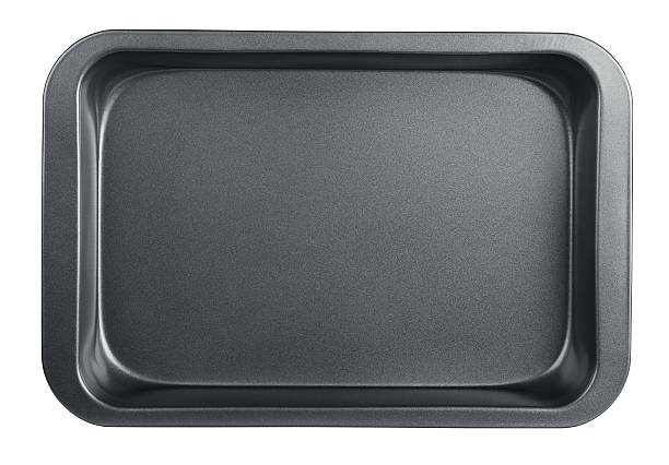 Baking tray Empty baking tray isolated on white baking sheet stock pictures, royalty-free photos & images